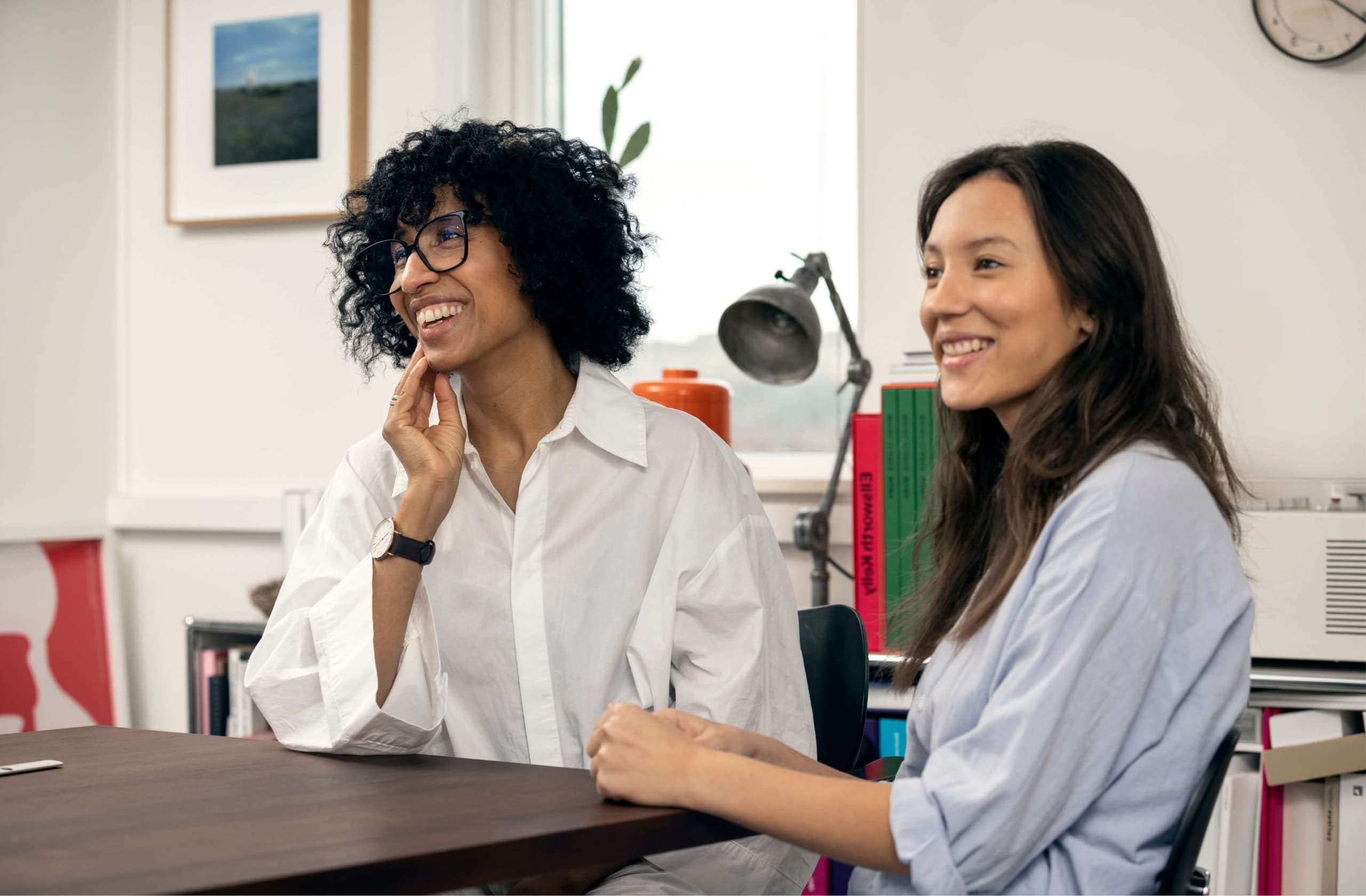 Two colleagues in a healthy office work environment supported by occupational health expertise